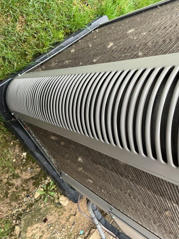 Completed annual furnace tune-up on 10-year-old system. Performed comprehensive maintenance inspection including filter replacement, burner assembly cleaning, heat exchanger examination, blower motor lubrication, and combustion analysis. Verified all safety controls, tested ignition system, and confirmed proper airflow and temperature rise across heat exchanger. System operating within manufacturer specifications with no deficiencies noted. Outdoor condenser unit inspected and photographed showing moderate debris accumulation on coil fins and surrounding pad area. Recommended coil cleaning service for improved efficiency during upcoming cooling season. All equipment functioning properly at time of service completion.