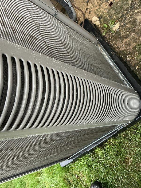 Completed annual furnace tune-up on 10-year-old system. Performed comprehensive maintenance inspection including filter replacement, burner assembly cleaning, heat exchanger examination, blower motor lubrication, and combustion analysis. Verified all safety controls, tested ignition system, and confirmed proper airflow and temperature rise across heat exchanger. System operating within manufacturer specifications with no deficiencies noted. Outdoor condenser unit inspected and photographed showing moderate debris accumulation on coil fins and surrounding pad area. Recommended coil cleaning service for improved efficiency during upcoming cooling season. All equipment functioning properly at time of service completion.