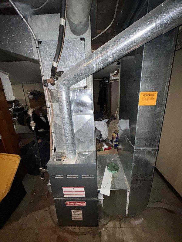 Conducted comprehensive assessment of non-operational central AC system that has been inactive for approximately 12 years. Performed detailed evaluation of existing Goodman furnace and air handler installation in basement utility area, documenting current equipment configuration including ductwork connections, return air plenum, and overall system layout. Photographed existing HVAC infrastructure to support replacement estimate development, capturing furnace unit specifications, duct routing, available workspace, and utility connections. Provided customer with professional quote options for complete AC system replacement to support their feasibility planning and decision-making process.