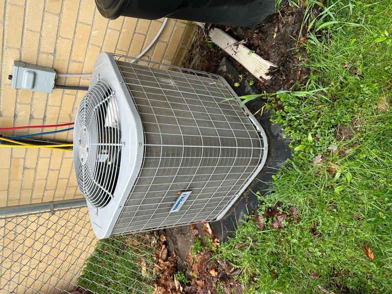 Completed annual cooling maintenance on residential outdoor condensing unit. Performed comprehensive system inspection, verified proper operation of compressor and condenser fan motor, checked electrical connections and disconnect box, and documented equipment condition with photographs. Unit found in good operating condition with no immediate service needs identified.