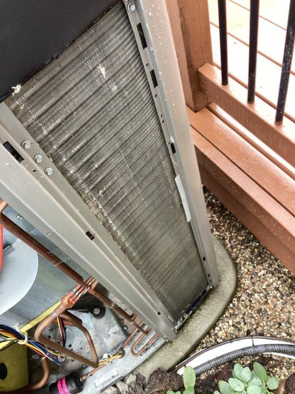 Completed annual preventative maintenance on outdoor condensing unit. Removed and cleaned condenser coil which showed moderate accumulation of dust, debris, and organic matter on fins and mesh screening. Inspected refrigerant lines, electrical connections, and compressor housing—all components found to be in operational condition with no immediate repairs required.