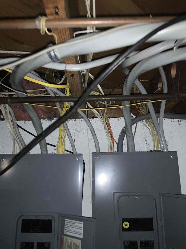 Conducted comprehensive on-site evaluation for full HVAC system replacement of 16-year-old air conditioning unit. Assessed existing furnace, air handler, ductwork connections, and electrical infrastructure including dual panel configuration and associated wiring runs. Documented current system conditions, equipment specifications, and installation requirements through photographic documentation to provide accurate replacement estimate for immediate system upgrade.