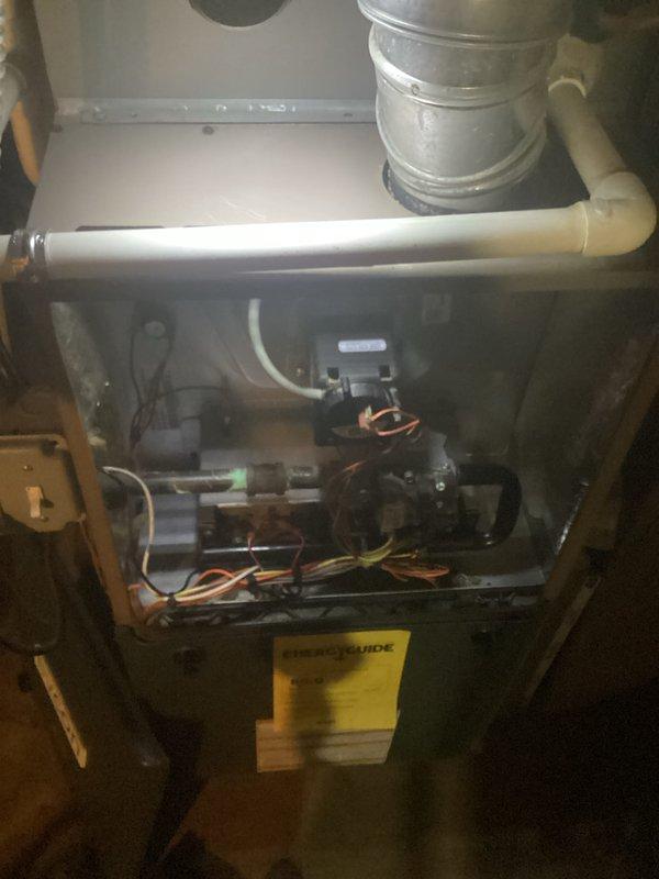 Completed comprehensive HVAC maintenance inspection on residential furnace unit. Removed access panels to inspect internal components including blower motor assembly, gas valve mechanisms, electrical connections, and refrigerant lines. All major components were examined for proper operation, wiring integrity verified, and system found to be in operational condition with no immediate repairs required.
