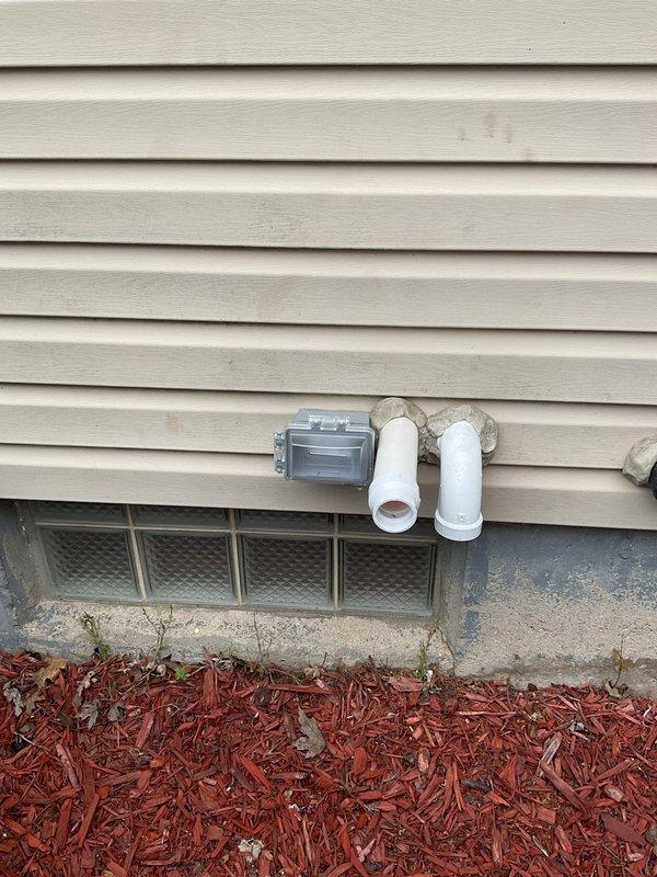 Responded to recall for GFCI compliance on recent HVAC installation. Inspected outdoor condensing unit location and confirmed electrical outlet installation meets NEC requirements for ground fault circuit interrupter protection within 25 feet of exterior equipment. Verified proper GFCI functionality and documented installation with photographs showing unit placement, electrical connections, and surrounding utility infrastructure including gas meter and foundation drainage systems.