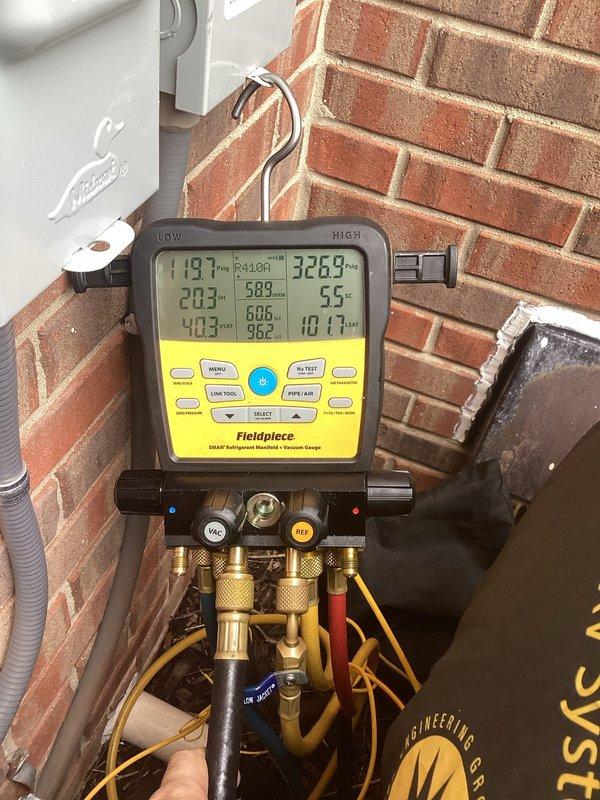 Completed annual cooling maintenance on residential air conditioning system. Performed comprehensive system diagnostics using digital manifold gauges, recording refrigerant pressures and temperatures across all service ports to verify proper system operation and charge levels. Inspected outdoor condenser unit, noting accumulated dirt and debris on cabinet surfaces; unit operational with condenser fan functioning properly.