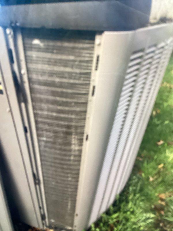 Completed annual cooling maintenance on residential outdoor condensing unit. Performed comprehensive inspection of heat exchanger coils, noting moderate accumulation of organic growth and debris on condenser fins. Cleaned coil surfaces to restore proper airflow and heat transfer efficiency. Inspected exterior cabinet panels and louvers for structural integrity and proper ventilation clearance. Verified unit placement and surrounding vegetation management. All system components assessed and operational parameters confirmed within manufacturer specifications following maintenance procedures.