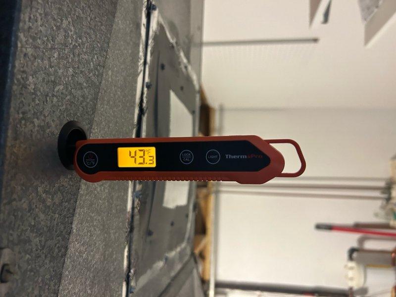 Completed annual HVAC maintenance on residential air conditioning system. Replaced air filter, performed routine cleaning and maintenance (RAC), and verified system operation with temperature readings showing 43°F output at evaporator coil. Outdoor condensing unit inspected and found in functional condition with normal weathering for outdoor installation.