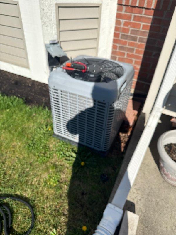 Completed annual cooling maintenance on residential split system air conditioning unit. Performed comprehensive inspection of outdoor condenser unit, verified proper operation of fan assembly and protective grille integrity, checked refrigerant lines and electrical connections, and confirmed unit was functioning within normal parameters. All components found in good working condition with no immediate service needs identified.