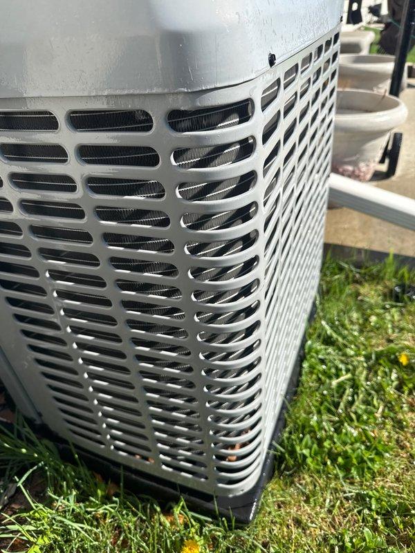 Completed annual cooling maintenance on residential split system air conditioning unit. Performed comprehensive inspection of outdoor condenser unit, verified proper operation of fan assembly and protective grille integrity, checked refrigerant lines and electrical connections, and confirmed unit was functioning within normal parameters. All components found in good working condition with no immediate service needs identified.