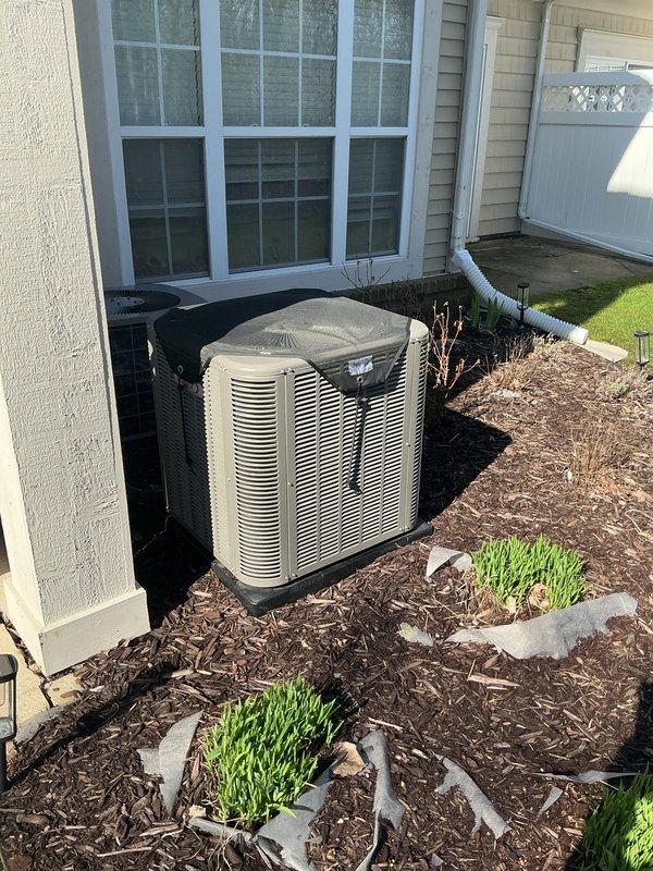 Completed annual heating maintenance and tune-up on residential furnace system. Performed comprehensive inspection of heating equipment, cleaned and adjusted burner assembly, checked gas pressure and combustion efficiency, inspected heat exchanger for cracks or deterioration, tested safety controls and limit switches, lubricated blower motor bearings, replaced air filter, verified proper airflow and temperature rise across heat exchanger, and tested thermostat operation. Also inspected outdoor air conditioning condenser units positioned on concrete pad with mulched landscaping surround. Confirmed both HVAC systems operating within manufacturer specifications with no immediate repairs required. All equipment left in proper working condition.