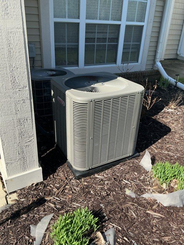 Completed annual heating maintenance and tune-up on residential furnace system. Performed comprehensive inspection of heating equipment, cleaned and adjusted burner assembly, checked gas pressure and combustion efficiency, inspected heat exchanger for cracks or deterioration, tested safety controls and limit switches, lubricated blower motor bearings, replaced air filter, verified proper airflow and temperature rise across heat exchanger, and tested thermostat operation. Also inspected outdoor air conditioning condenser units positioned on concrete pad with mulched landscaping surround. Confirmed both HVAC systems operating within manufacturer specifications with no immediate repairs required. All equipment left in proper working condition.