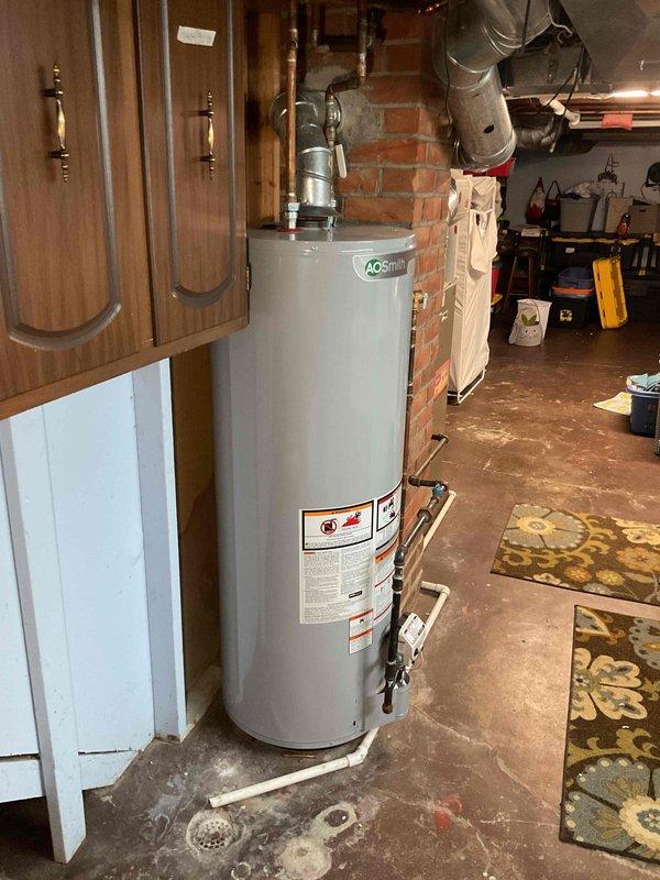 Completed estimate for furnace replacement in residential basement mechanical room. Documented existing Bryant Plus 90 high-efficiency furnace, associated ductwork, venting system, and surrounding utility infrastructure including water heater and electrical panel to provide accurate replacement specifications and equipment requirements.