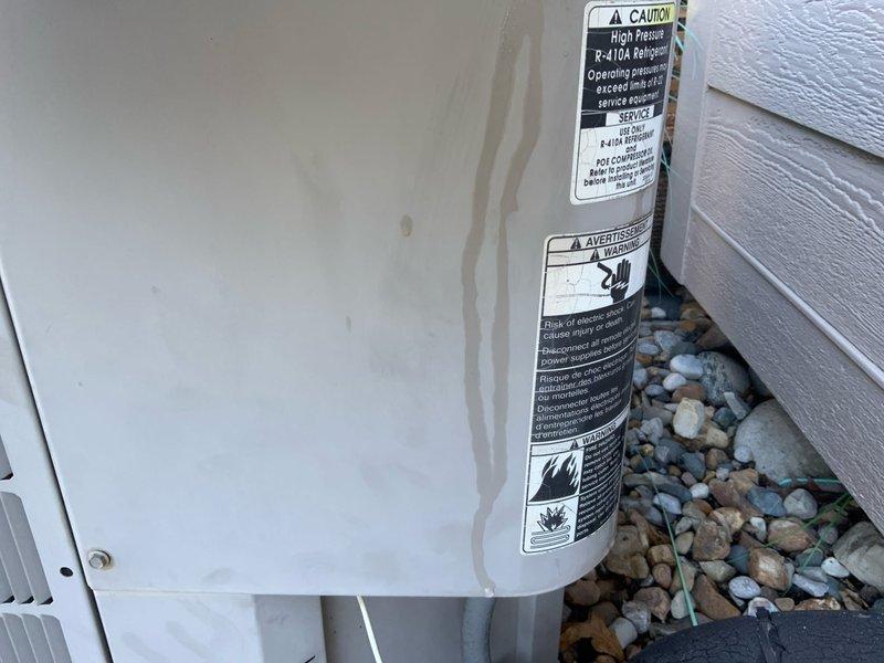 Conducted on-site assessment for complete HVAC system replacement estimate at residential property. Evaluated existing 20-year-old air conditioning unit utilizing R-410A refrigerant and 14-year-old furnace, both systems having reached end of serviceable life expectancy. Documented current equipment condition, installation configuration, and site specifications through comprehensive photography of outdoor condenser unit positioning, electrical disconnect location, and surrounding landscape considerations for replacement planning.