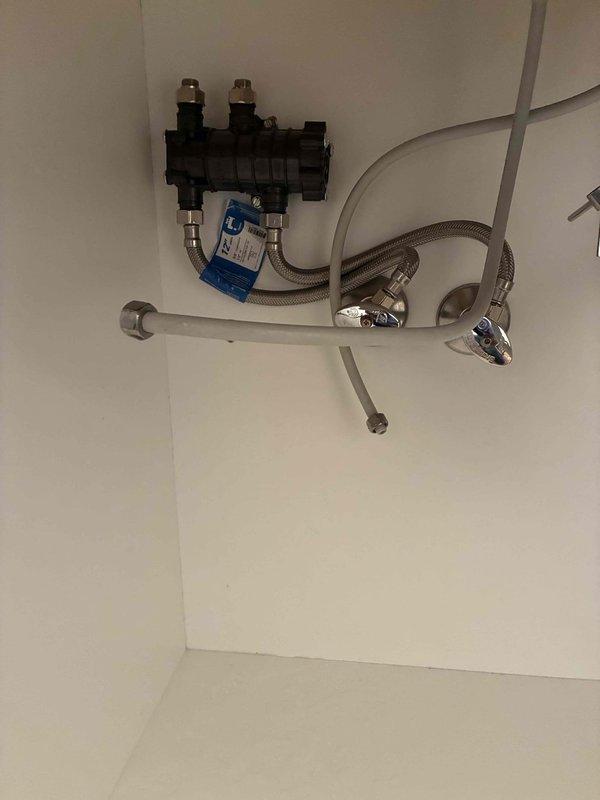 Responded to warranty call for malfunctioning Navien NaviCirc recirculation system that had been producing abnormal "blooping" noises and additional operational sounds since installation. Per customer request, removed the NaviCirc unit from the hot water recirculation system and restored plumbing connections to standard configuration. Unit will be processed for refund under warranty terms.