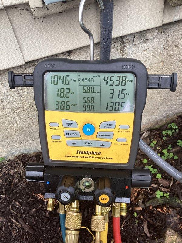 Completed routine air conditioning maintenance service on residential cooling system. Performed system diagnostics using refrigerant manifold gauge, recording operating pressures and temperatures to verify proper refrigerant charge and system performance. Confirmed thermostat operation and settings, with unit maintaining 68°F setpoint at 60% indoor humidity with heat set to 60°F and cooling set to 63°F. All system parameters found within normal operating range with no deficiencies noted.