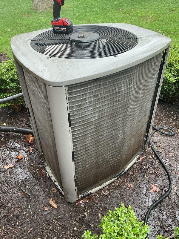 Completed annual cooling maintenance on residential split system air conditioning unit. Performed comprehensive inspection of outdoor condenser unit, assessed coil condition, verified proper operation of fan motor and compressor, and documented equipment status with photographs. No filter replacement required per service specifications.