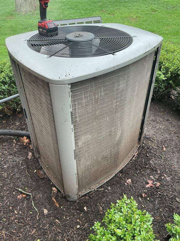 Completed annual cooling maintenance on residential split system air conditioning unit. Performed comprehensive inspection of outdoor condenser unit, assessed coil condition, verified proper operation of fan motor and compressor, and documented equipment status with photographs. No filter replacement required per service specifications.