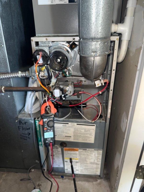 Completed comprehensive HVAC maintenance service on both heating and cooling systems. Performed electrical diagnostics on furnace unit using clamp meter to verify proper amperage draw and system performance, inspected blower motor assembly and capacitor, checked all electrical connections and wiring, and examined heat exchanger components. Serviced outdoor condenser unit including inspection of compressor operation, refrigerant levels, and overall system functionality. All equipment tested and operating within normal parameters.
