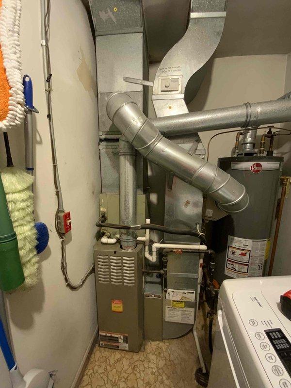 Completed on-site evaluation of existing HVAC system for replacement estimate. Inspected 20-year-old furnace and air conditioning equipment currently installed in utility room. Assessed condition of air handler, ductwork connections, and associated components. Documented existing equipment specifications, installation configuration, and mechanical room layout through photographs. Provided comprehensive replacement quote for both heating and cooling systems to facilitate customer's purchasing decision.
