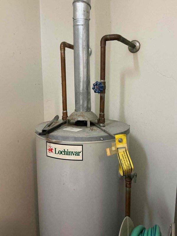 Conducted estimate for replacement of 26-year-old HVAC system including furnace, air conditioning unit, and water heater. Inspected existing Lochinvar water heater in walkway area showing signs of age and confirmed non-operational status. Evaluated furnace and air handler unit located in crawlspace with existing ductwork, copper piping, and ventilation systems currently operational. Documented equipment conditions, installation locations, and accessibility for replacement planning. Provided comprehensive assessment and replacement recommendations for all three units based on age, condition, and performance requirements.