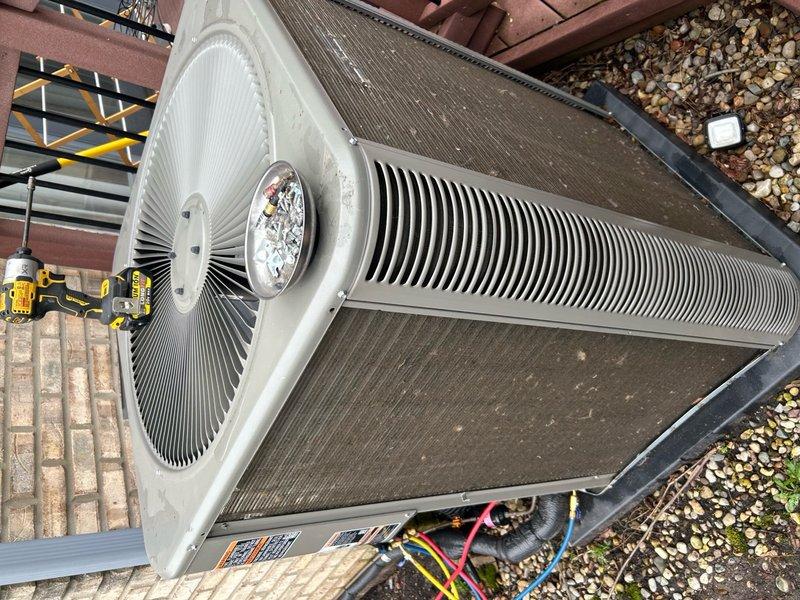 Completed annual cooling maintenance on outdoor condensing unit. Inspected system components, changed air filter, and performed leak detection testing which showed normal readings at 22.2 ppm. Unit operating within manufacturer specifications with refrigerant lines secure and fan assembly functioning properly.