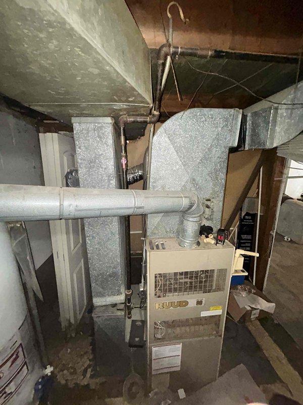 Completed full system estimate for residential HVAC replacement including existing RUUD furnace located in basement and RUUD air conditioning condenser unit positioned on exterior concrete pad. Assessed current system configuration, ductwork, venting, and condensate drainage setup to provide comprehensive quote for furnace and AC replacement under promotional offer, with customer requesting service within the next couple weeks.