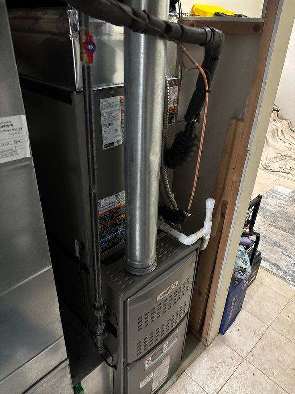 Successfully completed installation of a 3-ton air conditioning system with evaporator coil at rear location. Installed new outdoor condensing unit and indoor evaporator coil, connected refrigerant lines, and performed all electrical connections to existing furnace system. Verified proper refrigerant charge, tested system operation, and confirmed adequate airflow and cooling performance. All required permits were obtained prior to installation, and system was reconnected to existing ductwork and drainage lines.