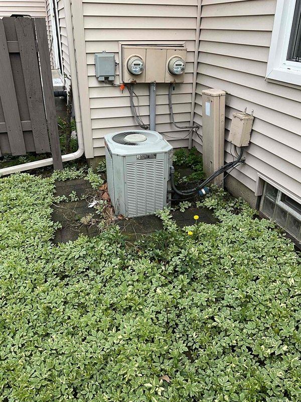Conducted on-site assessment of aging HVAC system with both air conditioning condenser and furnace estimated at 20+ years old. Documented existing equipment conditions through photographic inspection, including exterior condenser unit with visible wear and interior furnace components showing age-related deterioration. Prepared comprehensive replacement quote for complete system upgrade, discussing options for simultaneous replacement of both cooling and heating units to maximize efficiency and avoid future service interruptions.