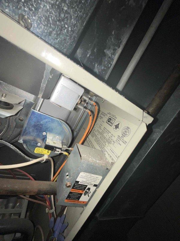 Conducted on-site assessment of aging HVAC system with both air conditioning condenser and furnace estimated at 20+ years old. Documented existing equipment conditions through photographic inspection, including exterior condenser unit with visible wear and interior furnace components showing age-related deterioration. Prepared comprehensive replacement quote for complete system upgrade, discussing options for simultaneous replacement of both cooling and heating units to maximize efficiency and avoid future service interruptions.