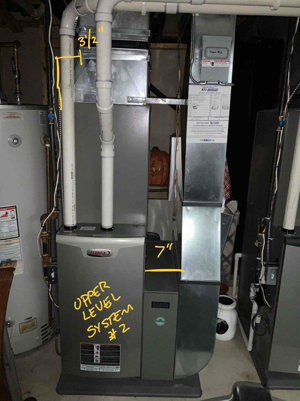 Completed full system estimate for main floor HVAC system. Evaluated 13-year-old Lennox XC17-036-230 air conditioning unit (S#5812E03034) with evaporator coil, which has experienced complete refrigerant blowout and is no longer under warranty. Confirmed furnace remains in good operational condition and does not require replacement at this time. Documented upper level system #2 installation including Lennox furnace, air handler components, and associated PVC venting and ductwork. Photographed electrical panel breaker assignments and mechanical room equipment configuration for replacement planning purposes.