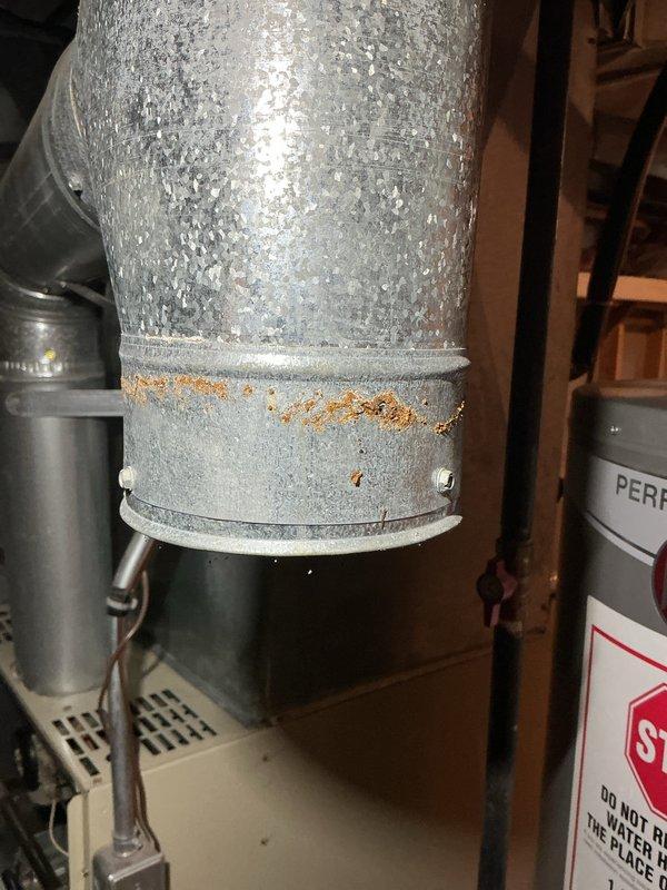 Completed annual cooling maintenance on rooftop zone system. Performed comprehensive inspection of electrical connections, condensate drainage system, and ductwork. Observed heavy condensation on supply duct with rust formation on coupling band, indicating proper system operation in cooling mode. Verified electrical connections and circuit protection functioning properly. No filter replacement required per maintenance schedule.