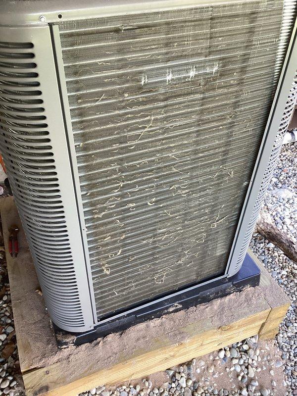 Completed annual HVAC maintenance on outdoor condensing unit. Performed thorough cleaning of condenser coils which showed heavy accumulation of dirt, dust, and environmental debris on metal fins and mesh grilles. Inspected refrigerant lines and connections, verified gauge readings, and assessed overall unit condition. Replaced air filter and cleaned evaporator pad as part of routine maintenance protocol.