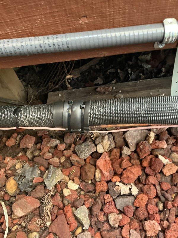 Completed installation callback to address three items identified post-installation: installed missing screw on air conditioning unit, secured loose metal ring clamp on furnace rubber boot connection, and tightened loose metal clamp on aluminum refrigerant line. All components verified secure and system operational per manufacturer specifications.