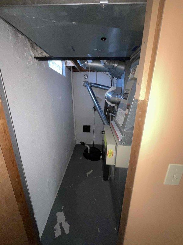 Provided comprehensive estimate for furnace and air conditioning replacement system in basement mechanical closet. Current 10+ year old equipment operational but nearing end of service life. Evaluated existing installation including ductwork configuration, electrical connections, and space constraints within confined utility area. Assessed requirements for new high-efficiency HVAC system installation to replace aging equipment and improve home comfort and energy efficiency.