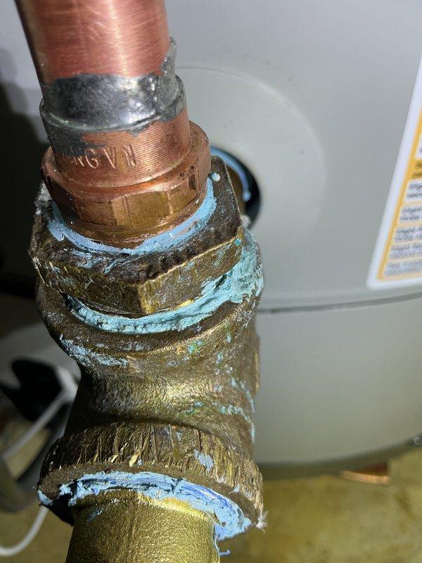 Completed warranty hot water tank replacement due to leaking from bottom of original unit. Installed new water heater with expansion tank as specified, utilizing proper copper piping connections and brass fittings with PTFE thread seal. All plumbing connections tested and verified leak-free upon completion.