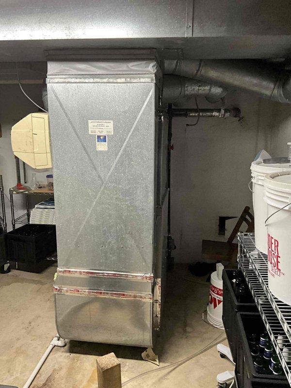 Completed comprehensive estimate for replacement of aging HVAC system including 17-year-old gas furnace and 10-year-old air conditioning unit located in basement utility area. Performed thorough assessment of existing equipment configuration, including galvanized steel furnace cabinet, air handler with humidification component, metal plenum assembly, and ductwork connections. Documented current system specifications, photographed existing installation showing PVC condensate drainage, flexible duct connections, and equipment placement on concrete floor for replacement planning purposes.