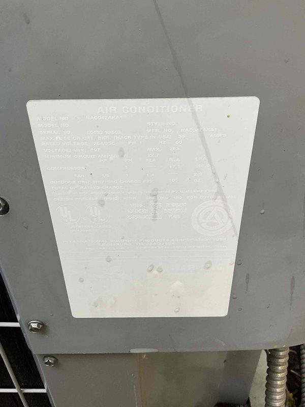 Conducted on-site estimate for air conditioning system replacement on 16-year-old unit. Documented existing equipment specifications from manufacturer label and photographed current installation including attic-mounted air handler with Air Scrubber air quality system and PVC condensate drainage. Customer requested immediate replacement timeline; follow-up quote to be provided for complete system replacement.