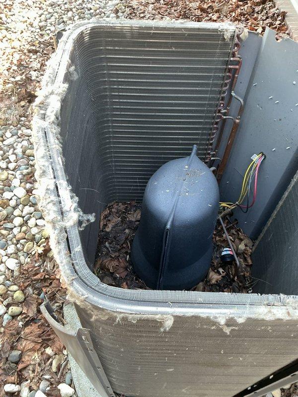 Performed callback maintenance service on HVAC system. Rinsed condenser coils with hot water using customer-provided hose from garage to remove accumulated dirt, debris, and organic matter visible on coil fins. Updated maintenance charts in basement to reflect previously completed work including filter replacements, evaporator pad installations, and UV bulb changes. Collected payment for annual membership and components already installed during prior service visit.