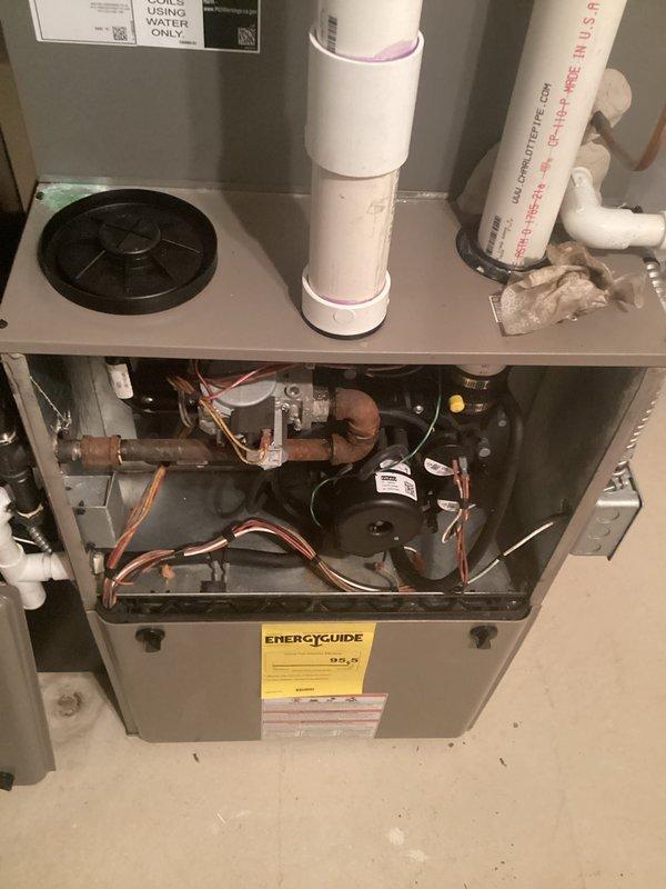 Responded to customer concern regarding gas odor detected near furnace exhaust during equipment operation. Performed comprehensive inspection of 12-year-old gas furnace system located in basement, including examination of heat exchanger, burner assembly, gas valve connections, and exhaust venting system. Inspected all copper gas lines, PVC exhaust and intake piping, blower motor assembly, electrical connections, and control board for signs of leakage, deterioration, or improper operation. Completed furnace tune-up including cleaning and adjustment of burner assembly, verification of proper combustion, and safety system testing to ensure unit operates within manufacturer specifications.