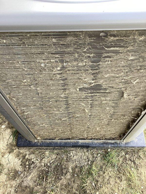 # HVAC Repair - No Cooling Issue

Responded to a no-cooling complaint on a 3-year-old Lennox central air conditioning system. Upon arrival, confirmed unit was running but delivering ambient temperature air with no cooling capacity.

## Diagnostic Findings

Conducted thorough system inspection and identified severe airflow restrictions as primary cause of cooling failure. Outdoor condenser coils found heavily contaminated with accumulated dirt, dust, and environmental debris, completely blocking airflow through fins. Indoor air filter discovered completely clogged with dense layer of dust and particulate matter, restricting return air supply to system.

## Work Performed

- Removed and replaced severely contaminated air filter
- Performed deep cleaning of outdoor condenser coil assembly using appropriate coil cleaning solution and equipment
- Cleared all debris from condenser unit exterior and surrounding area
- Verified proper airflow through both indoor and outdoor components
- Tested