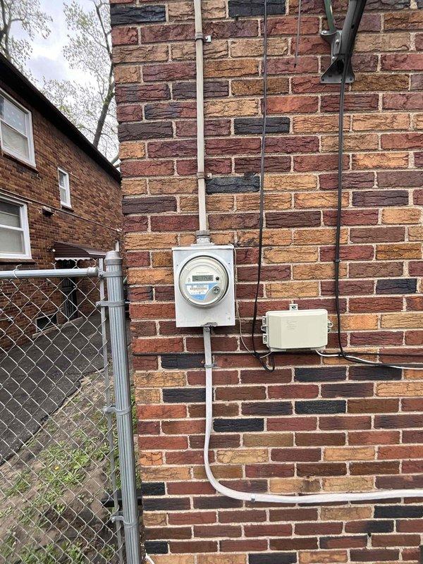 Conducted on-site assessment for new central air conditioning system installation at residential property currently without existing central AC. Evaluated home infrastructure including electrical service capacity at exterior meter location, existing thermostat wiring and placement, and potential equipment placement areas. Documented current digital thermostat configuration showing 70-degree setting and reviewed home's brick exterior construction for optimal condenser unit positioning near electrical service panel. Prepared comprehensive quote for complete central air system installation including equipment specifications, ductwork requirements, and necessary electrical upgrades.