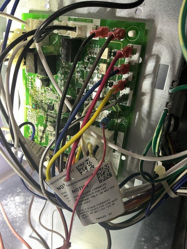 Responded to no-cool complaint on 4-year-old Goodman central air conditioning system with abnormal operating noise. Upon inspection, accessed control board housing and identified failed capacitor causing compressor to run inefficiently and produce unusual sounds. Replaced defective dual-run capacitor, verified proper voltage at control board terminals, and tested system operation. Unit now cooling properly with normal sound levels and amperage readings within manufacturer specifications.