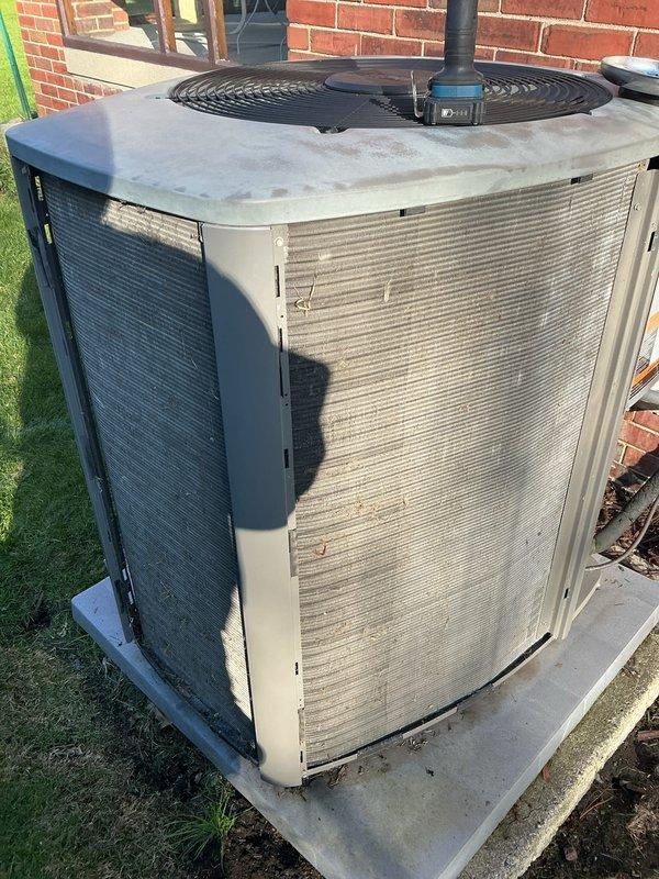 Completed annual cooling maintenance on residential split system. Performed comprehensive inspection of outdoor condensing unit, verified proper operation of compressor and condenser fan motor, checked refrigerant levels, cleaned condenser coils, and inspected electrical connections. Unit found in operational condition with normal wear consistent with age. Replaced air filters as requested and confirmed system is ready for cooling season.