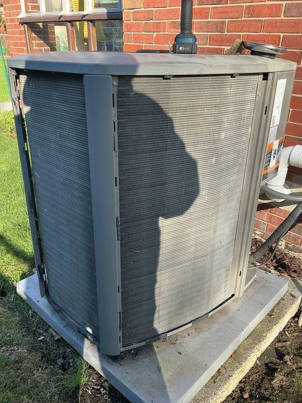 Completed annual cooling maintenance on residential split system. Performed comprehensive inspection of outdoor condensing unit, verified proper operation of compressor and condenser fan motor, checked refrigerant levels, cleaned condenser coils, and inspected electrical connections. Unit found in operational condition with normal wear consistent with age. Replaced air filters as requested and confirmed system is ready for cooling season.