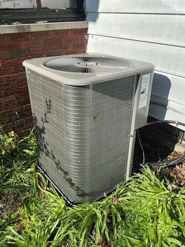 Completed annual cooling maintenance on residential air conditioning system. Replaced air filter and evaporator pad as part of routine preventive maintenance. Inspected outdoor condenser unit, verified proper operation of all components, and documented equipment condition with photographs showing unit positioned against building foundation with adequate clearance for airflow.
