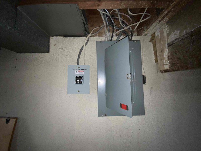 Conducted on-site evaluation for mini split air conditioning installation in a single room with no existing HVAC equipment. Assessed electrical infrastructure in basement utility area, including existing panels and available circuits to support new system, and evaluated potential installation locations in unfinished garage space. Documented site conditions and provided quote for complete mini split system installation with requested completion within 30-day timeframe.