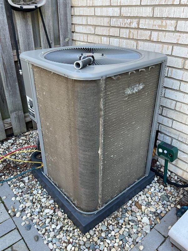 Completed scheduled Air Care Maintenance on residential outdoor condensing unit. Performed comprehensive system inspection, replaced air filter, cleaned condenser coils which showed heavy dust and dirt accumulation, and verified proper system operation. Unit tested and left in good working condition.