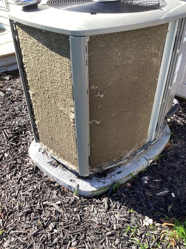 Completed scheduled air conditioning maintenance on residential outdoor condenser unit. Replaced air filter as identified spot item and confirmed as customer-owned device. Unit exterior shows normal weathering with accumulated dirt and debris on panels; condenser coils and fan grille inspected and found operational. System running within normal parameters upon completion of maintenance visit.