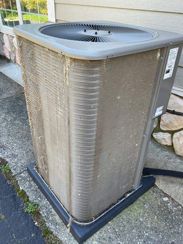 Completed preventative maintenance on two residential air conditioning systems. Upon arrival, exterior condenser units showed significant accumulation of dirt, dust, and debris on coil fins and housing panels. Performed thorough cleaning of condenser coils, removed cobwebs and surface contamination from unit exteriors, and verified proper airflow through heat exchanger surfaces. Connected refrigerant manifold gauges and diagnostic equipment to measure system pressures and temperatures across both units. All readings indicated normal operating parameters with appropriate superheat and subcooling values. Confirmed proper refrigerant charge levels, verified compressor operation, and ensured optimal system performance for continued reliable cooling operation.