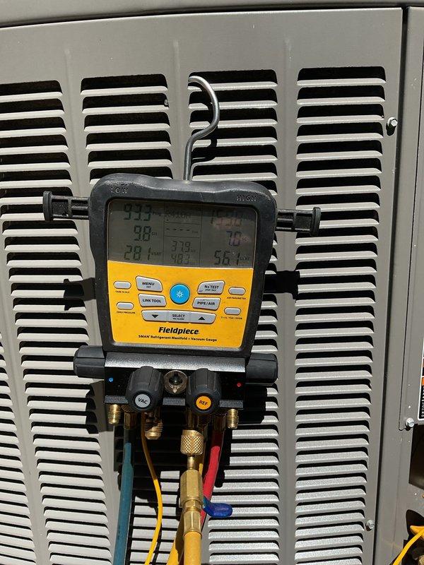 Completed preventative maintenance on two residential air conditioning systems. Upon arrival, exterior condenser units showed significant accumulation of dirt, dust, and debris on coil fins and housing panels. Performed thorough cleaning of condenser coils, removed cobwebs and surface contamination from unit exteriors, and verified proper airflow through heat exchanger surfaces. Connected refrigerant manifold gauges and diagnostic equipment to measure system pressures and temperatures across both units. All readings indicated normal operating parameters with appropriate superheat and subcooling values. Confirmed proper refrigerant charge levels, verified compressor operation, and ensured optimal system performance for continued reliable cooling operation.